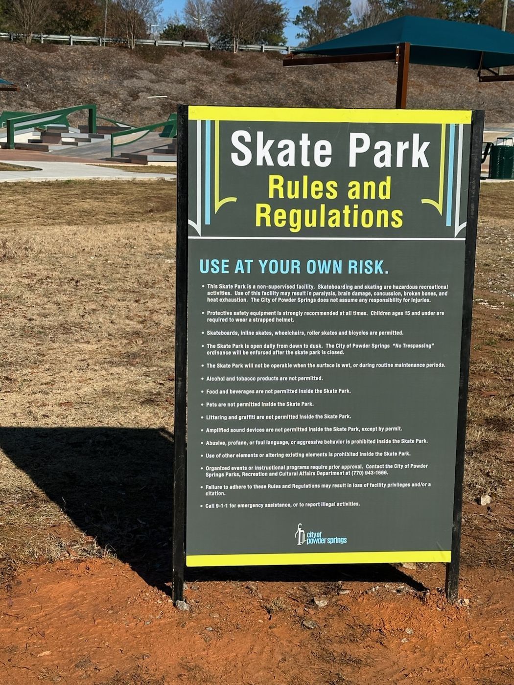 Skate park rules and regulations sign installed outdoors for City of Powder Springs