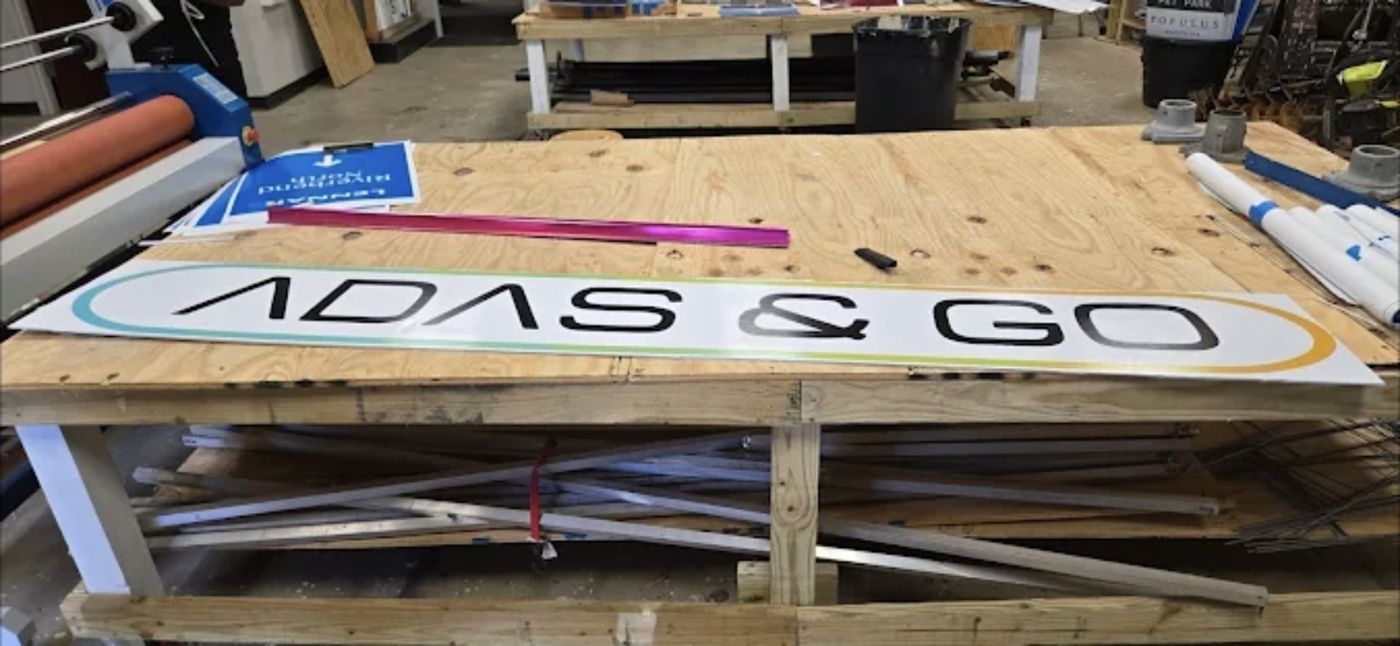 ADAS and GO storefront building sign panel printed and laminated